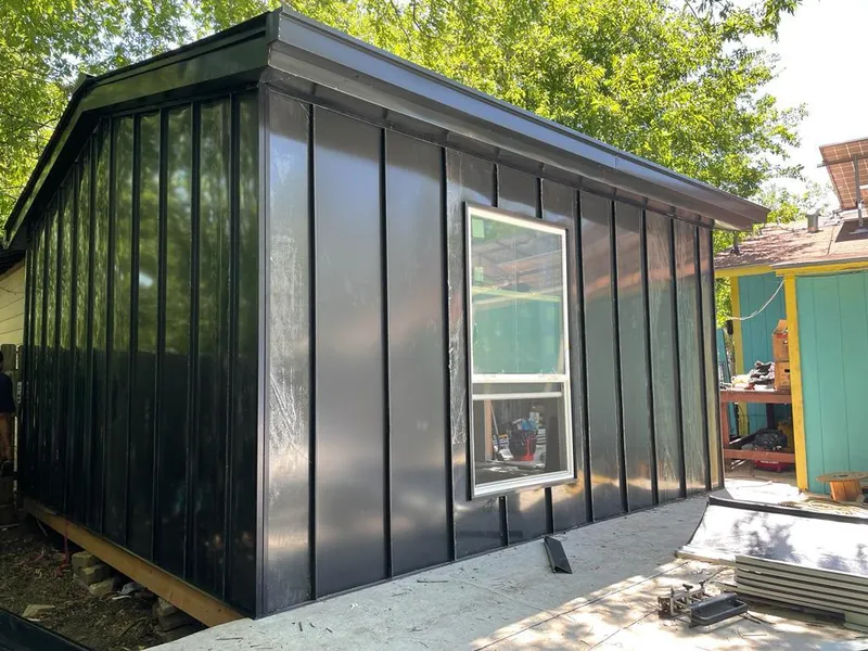 Black standing seam metal wall panels for Roof Inspection in Lowell