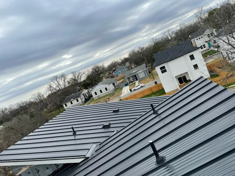 Standing seam metal roof panels with vents for Skylight Repair in Lowell